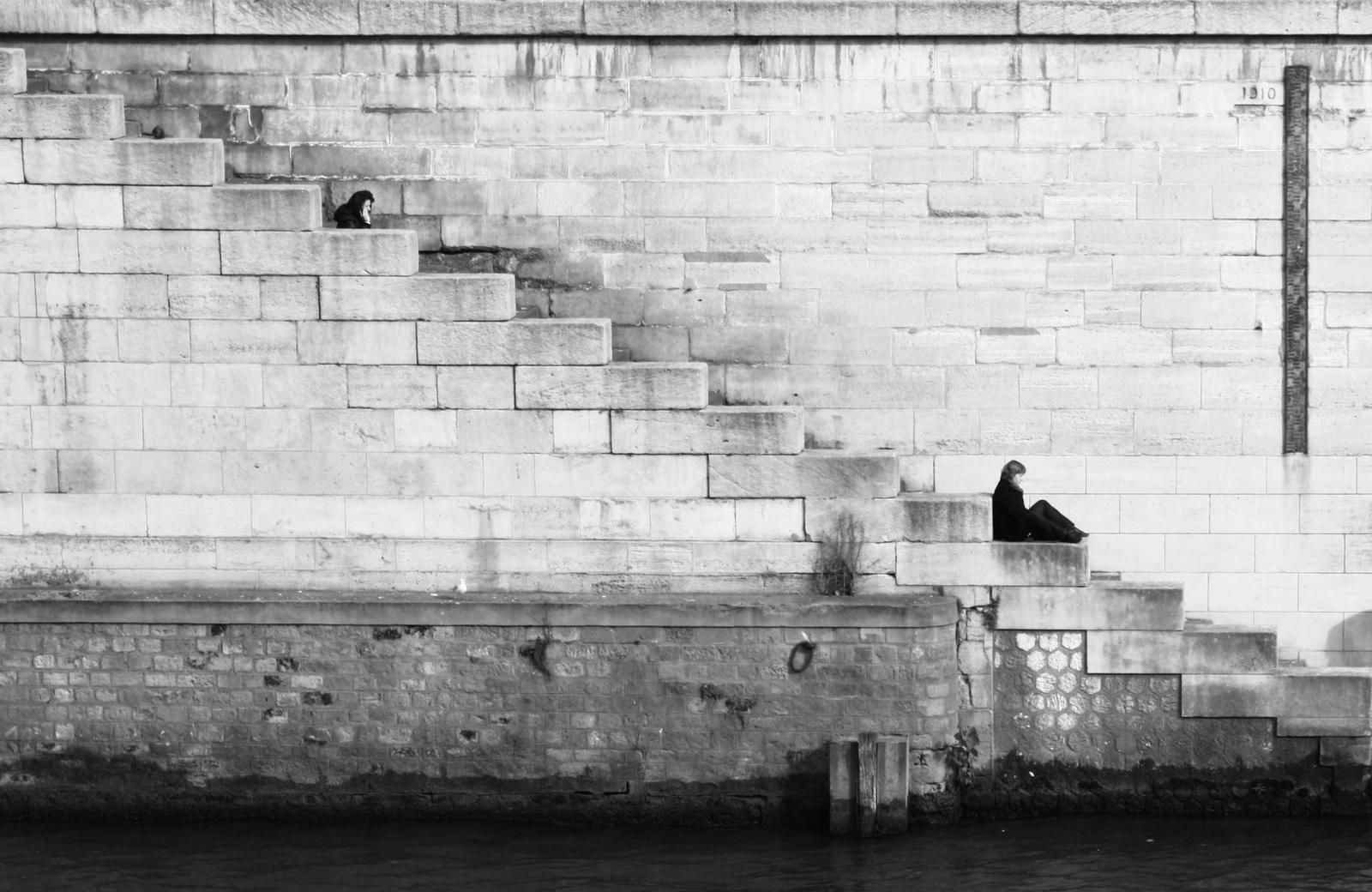 Stone stairs along a pale wall