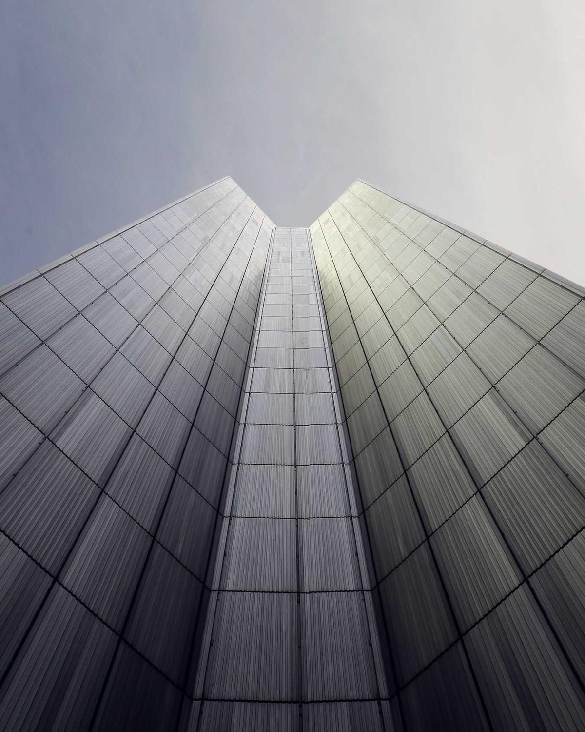 A glass tower seen from below